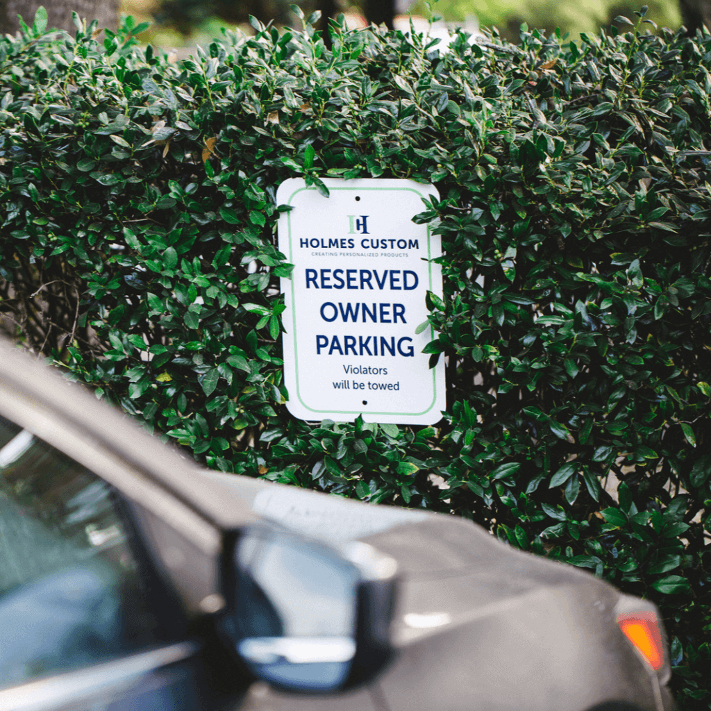 custom parking sign in a parking lot