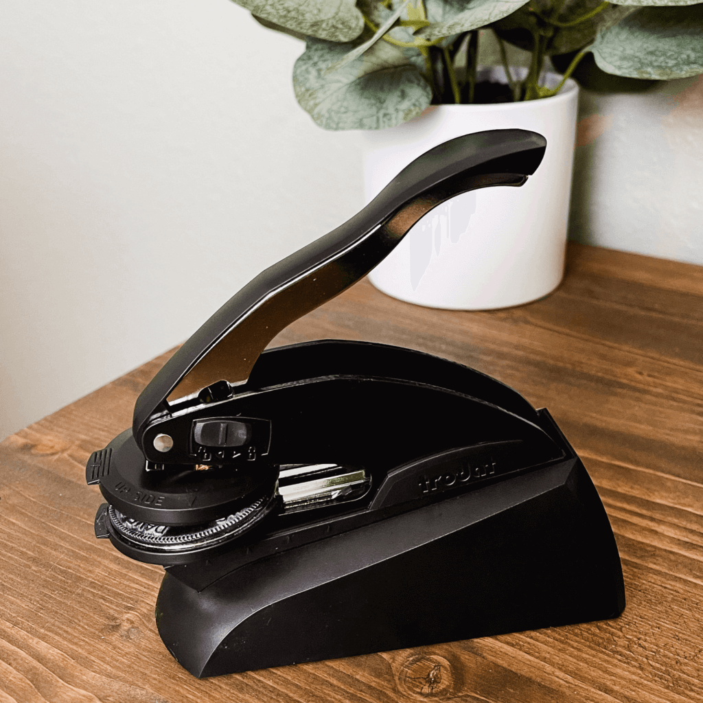 embosser body on a wooden desk