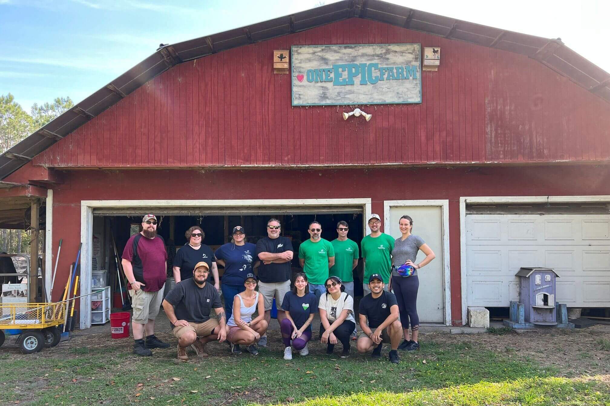 HC Brands Employees Posing In Front Of One EPIC Farm Barn